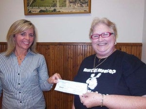 Women of the Moose Lodge recently donated $500 to Hospice. Pictured is Frieda Boelke presenting a check to Jackie Carstens of Hospice. --Submitted