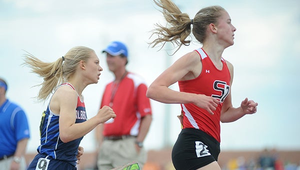 Albert Lea's Crissy Monson pursues Shakopee's Maria Hauger in the 1600-meter run at the Class 'AA' state track and field meet in St. Paul Saturday. — Rocky Hulne/Austin Daily Herald