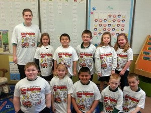St. Theodore first-graders received T-shirts through the Albert Lea Professional Fire Fighter’s first-grade fire education program on May 10. To get their T-shirts, the kids had to review homework with with their parents regarding fire safety. --Submitted