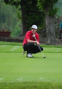 Cobi Bullerman, a senior from of United South Central, takes a look at the green Tuesday at the Class A state golf tourney. — Micah Bader/Albert Lea Tribune    