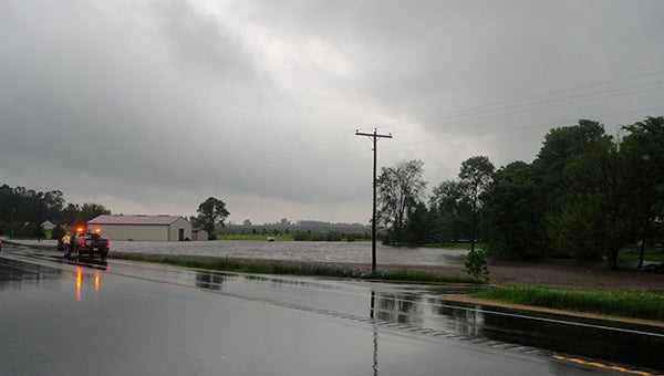 Flooding caused by Wednesday’s storm caused part U.S. Highway 65 south of Interstate 35 to be limited to one lane of traffic.  --Brandi Hagen/Albert Lea Tribune
