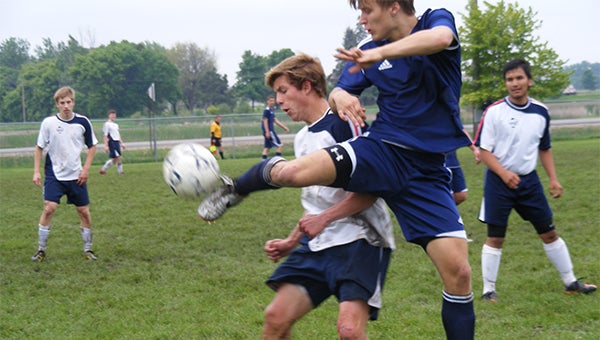 Preston Smith of Albert Lea’s U19C2 boys’ soccer team battles a Buffalo defender June 9 for possession of the ball. Albert Lea tied Buffalo 3-3. — Submitted