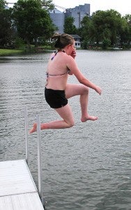 Autumn Anderson, 13, jumps off the public dock into Morin Lake on Friday evening. A half dozen children were swimming Friday as Morin Lake Days activities were happening. -- Tim Engstrom/Albert Lea Tribune