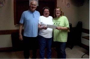 The Eagles Club presents a $500 check to Christa Stieler for the Humane Society of Freeborn County. Presenting the check is Sid Johnson and Ethel Lee Moen.