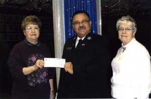 The Eagles Club donated $500 to the Salvation Army food shelf. Accepting the check is Oney Castillo of the Salvation Army. Presenting the check is Marlyss Johnson and Linda Eggleston.