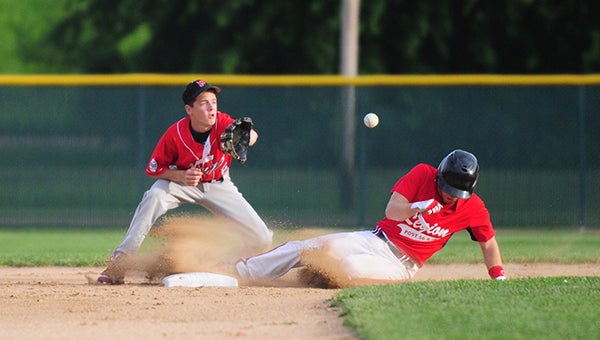 Tommy Olmstead of Albert Lea/Austin steals second base Wednesday against New Richland. Olmstead was 2-for-3 at the plate. He scored two runs, knocked in two runs and had two stolen bases. — Micah Bader/Albert Lea Tribune