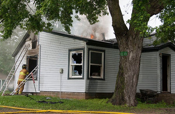 Emmons firefighters respond to a house fire Tuesday afternoon at 50359 U.S. Highway 69. -- Sarah Stultz/Albert Lea Tribune