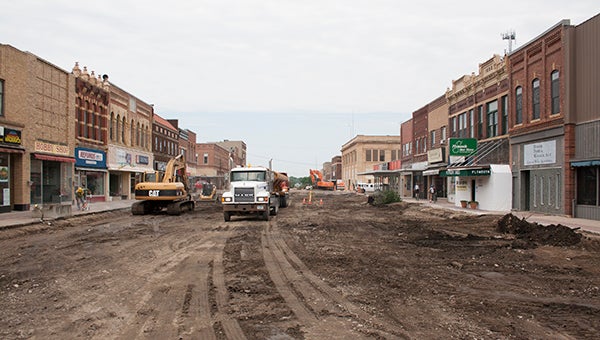 Construction crews work Tuesday on the reconstruction of Broadway between William and Clark streets in Albert Lea. The reconstruction spans from Fountain Street to Main Street. --Sarah Stultz/Albert Lea Tribune