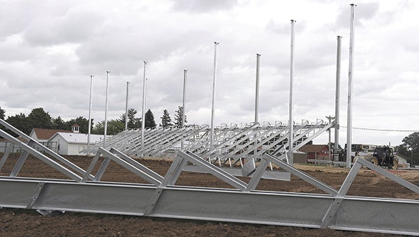The new grandstand at the Mower County Fairgrounds takes shape as a few remaining pieces lay nearby. -- Eric Johnson/Albert Lea Tribune