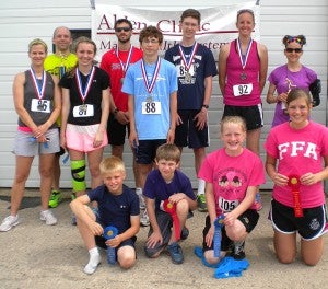 Competitors from the 2013 Alden Fun Run display their hardware after the race on June 14. Front row from the left are Dugan Soost, Aidan Cummings, Sierra Dahlen and Mallory Mattson. Middle row from the left are Kristin Hamburg, Carol Lein and Johnathan Lein. Back row from the left are Jamie Anderson, Frank Suera, Chris Mulholland, Melissa Wasmoen and Stacy Doppelhammer. Results are below. — Submitted