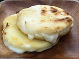 Arepas are cheese-stuffed corn tortillas.