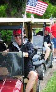 Bob Dickerman drives a golf cart at Green Lea Golf Course Saturday during the eighth annual Corey Goodnature Golf Classic. — Micah Bader/Albert Lea Tribune