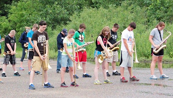 Students stand at parade rest until their performance. The band will perform in three events. The Third of July Parade begins at 6 p.m. Wednesday. --Erin Murtaugh/Albert Lea Tribune
