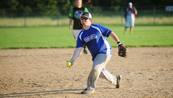 Brady Engelby of the Cars-N-Credit/Army National Guard coed softball team throws a pitch against Re/Max Sunday at Snyder Field. Cars-N-Credit/National Guard won 20-19. — Micah Bader/Albert Lea Tribune