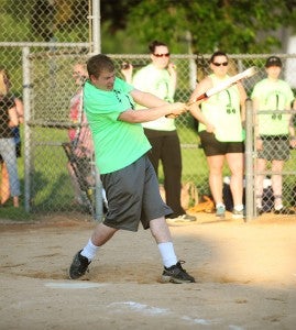 Tim Schaffer of the Master Batters coed softball team takes a swing Sunday against Our Savior’s Lutheran Church. — Micah Bader/Albert Lea Tribune     