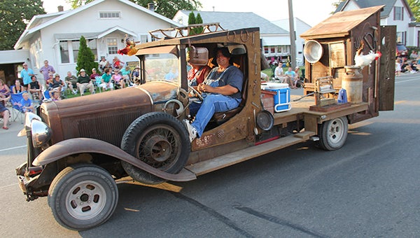 Two Shriners ride in a rusty 1931 Buick with an outhouse on the back in the 2012 Third of July Parade through downtown Albert Lea. --Tim Engstrom/Albert Lea Tribune