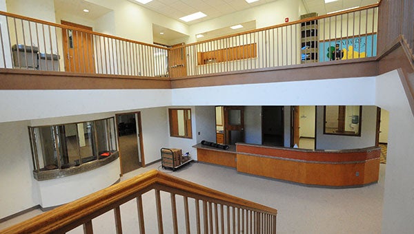 The two-story expansion at the Freeborn County Historical Museum incorporates local history in the architecture. On the upper level of the expansion is a statue of Col. Albert Lea and columns from the old high school and on the lower level is the ticket booth from Cap Emmons Auditorium. -- Brandi Hagen/Albert Lea Tribune