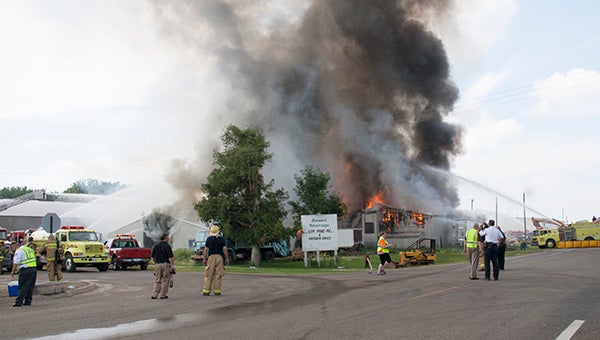 Firefighters from more than a dozen fire departments in and around Freeborn County responded to the blaze Monday afternoon at 101 Netherlands Ave. W. in Hollandale. -- Sarah Stultz/Albert Lea Tribune 