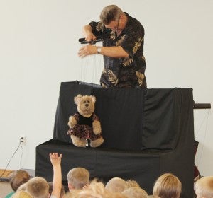 Jim Jayes performs a puppet show Thursday for children at the Albert Lea Public Library as part of the library’s summer reading program.