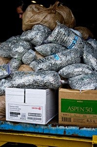 More than 1 million pop tabs sit in a large pile on June 20 before being turned in at a recycling center in St. Paul. The proceeds from the tabs went to benefit The Ronald McDonald House.  