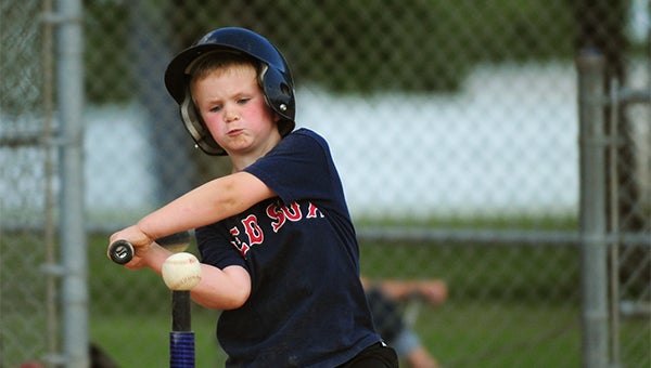 Wade Juveland of the Albert Lea Little League tee-ball Red Sox team takes a cut Wednesday at the ball. View tournament results and more photos in Sunday’s Tribune. — Micah Bader/Albert Lea Tribune