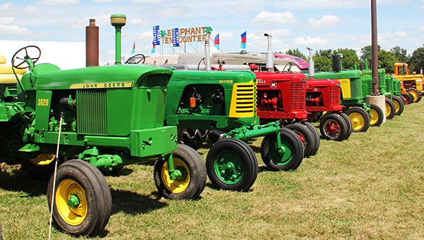 Antique John Deere and Farmall tractors are lined up at the Freeborn County Fair. Last year there were about 115 tractors on display. -- Erin Murtaugh/Albert Lea Tribune