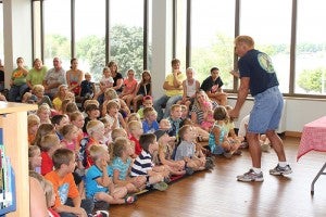 Children are excited to hear the Zoo Man introduce the first animal during a special program at the Albert Lea Public Library on Thursday. -- Quinn Andersen/Albert Lea Tribune 