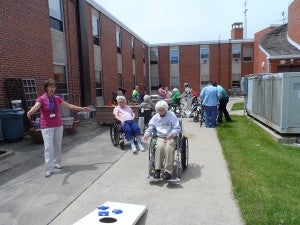 Bean bag tournaments are held each Monday at St. John’s Lutheran Home. Elmer Ohm made the boxes, and the residents enjoy the activity. --Submitted