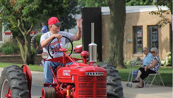 Tractor owners ride through Albert Lea for the fifth annual Shinefest Tractor Ride on Saturday. -- Kelli Lageson/Albert Lea Tribune