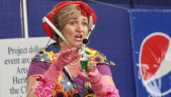 Greta Grosch, playing Lois Jenson, describes beauty tips based on household kitchen items Wednesday at the Freeborn County Fair as part of the Looney Lutherans’ show in the Fairlane Building. -- Sarah Stultz/Albert Lea Tribune 