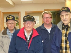 Cousins Emil Prantner, left, Ernie Benesh and Milo Belshan, far right, stand with Matt Greibrok, second from right. The three cousins have been working to put up a veteran’s memorial. --Submitted