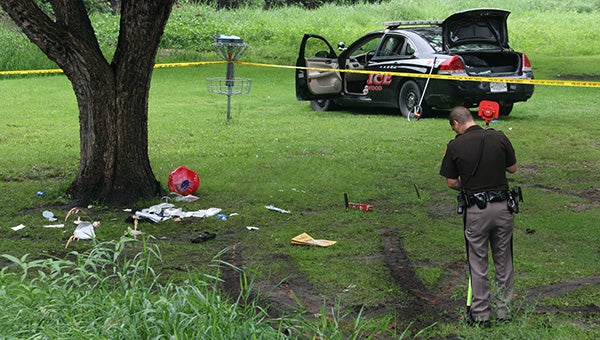 An Iowa State Patrol officer looks at the scene of an alleged stabbing at Swensrud Park in Northwood Monday afternoon. -- Sarah Stultz/Albert Lea Tribune     
