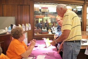 Cancer survivors register for the Relay for Life on Thursday afternoon at Stadheim Jewelers. Survivors also received a Pandora bracelet charm. Stadheim’s has been giving charms for the past six years. --Erin Murtaugh/Albert Lea Tribune