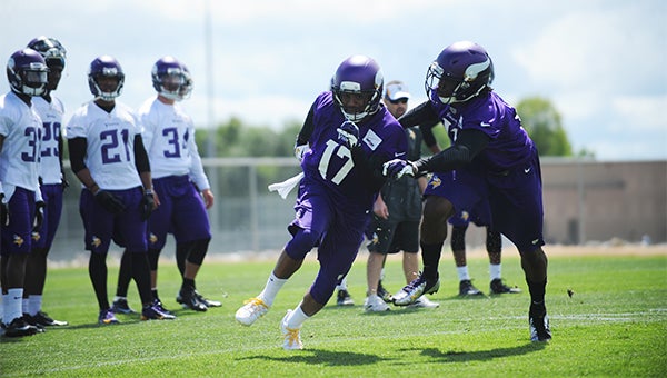 Jarius Wright, left, a second-year reciever out of Arkansas beats Stephen Burton off the line during a drill during the Minnesota Vikings training camp at Minnesota State University. — Micah Bader/Albert Lea Tribune