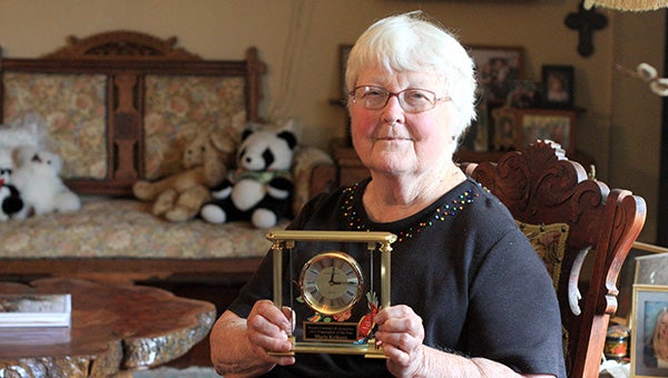 Marie Krikava holds the clock she received for being named as Western Fraternal Life Association Fraternalist of the Year in June. --Brandi Hagen/Albert Lea Tribune