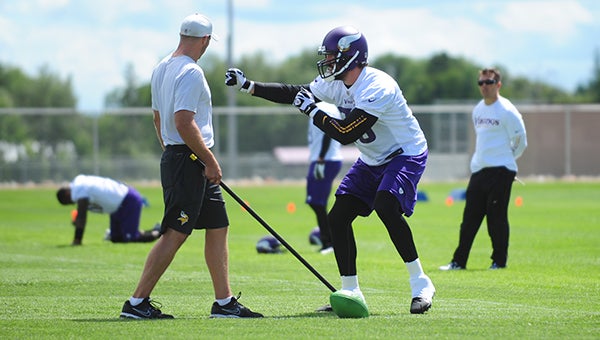 Jared Allen performs a drill during the first day of the Minnesota Vikings training camp at Minnesota State University in Mankato. Allen is one of multiple veterans on Minnesota’s defensive line who will be rotated on and off the field according to defensive coordinator Alan Williams. — Micah Bader/Albert Lea Tribune