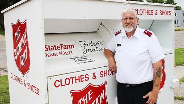 Salvation Army Capt. Jim Brickson leans against a drop box at the former Buy-N-Save on South Broadway last week. The second drop box, behind him, is awaiting approval for a location. --Tim Engstrom/Albert Lea Tribune