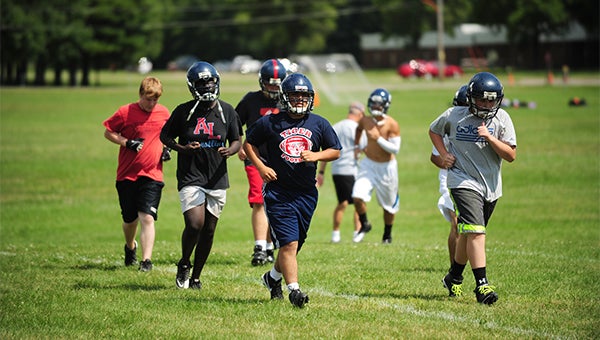 Albert Lea varsity football players round a corner Thursday at practice. The Tigers began practice Monday and will kick off the season at Mankato West at 7 p.m. on Aug. 29. Albert Lea will host its home opener against Rochester John Marshall at 7 p.m. on Sept. 6. The Tigers return 20 letter winners, including senior two-time All-Conference tight end Cody Scherff. — Micah Bader/Albert Lea Tribune