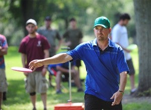 Chris Meyer, 33, of Woodbury throws a disc during a throw-off for the ace pool at Oak Island Disc Golf Course at Bancroft Bay Park. Because no one hit a hole-in-one, players competed to see who could get their disc in or closest to a basket. Meyer didn’t win the throw-off, but he did win the tournament. -- Micah Bader/Albert Lea Tribune