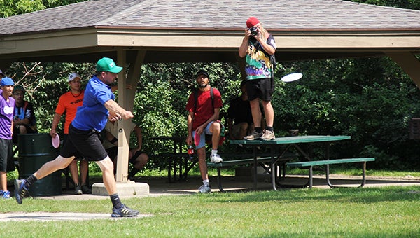 Chris "Critter" Meyer tees off at Hole 6 of Oak Island Disc Golf Course at Bancroft Bay Park on Sunday during the showcase final-nine holes. -- Tim Engstrom/Albert Lea Tribune