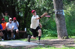 Chris Hall of Zimmerman throws a disc on Hole 1 during the final round of the Minnesota State Disc Golf Championships at Oak Island Disc Golf Course. -- Micah Bader/Albert Lea Tribune