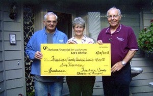 The Freeborn County chapter of Thrivent board members Mervil Boettcher and Gary Hunnicutt present a $600 supplemental funding check from Thrivent Financial for Lutherans to Pat Mulso, executive director of the Freeborn County Historical Society, for their fundraiser on July 18.