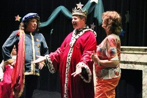 The King, played by Glen Parson, says he wants to find beautiful ladies to attend the ball he is throwing for his son, the Handsome Prince. To the left is Duke Ferdinand, played by Rory Matson, and to the right is the Fairy Godmother, played by Sue Jorgensen.