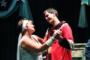 Lisa Sturtz as Cinderella holds hands with Stuart Ness, who plays the Handsome Prince.