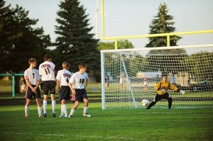 Albert Lea defenders form a wall in an attempt to block a shot on goal by St. Peter. From left are Timothy Furland, Tyler Vandenheuvel, Toby Schmitt and Ashton Friend. Nate Hogstad reacts in the goal. The shot was wide right. — Micah Bader/Albert Lea Tribune    