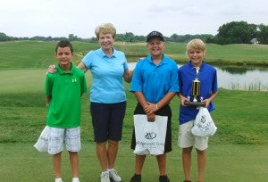 Max Pleimling won the 12-and-under age group at the Mrs. Gerry’s Junior Tournament at Wedgewood Cove Golf Club with a score of 55. From left are Manning Lane, Gerry Vogt, Marty Syverson and Pleimling. — Submitted    