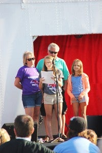 Kailey Christensen tells the story of her mom, Kiki’s, battle with breast cancer during opening ceremonies at the Freeborn County Relay for Life. -- Erin Murtaugh/ Albert Lea Tribune