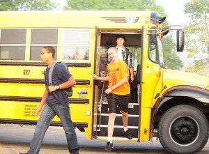 Students get off a school bus at Southwest Middle School this morning. Some of the students went inside the school and some of the students transferred to other buses.