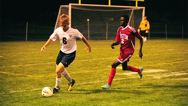 Tony Schmitt of Albert Lea clears the ball Thursday against Austin. The Tigers lost 3-1 in overtime. — Micah Bader/Albert Lea Tribune    