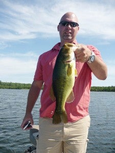 Anthony Chariton of Albert Lea caught a 23 1/2-inch bass on Coon-Sandwick Lake  with an 8-inch perch-pattern weedless swimbait lure while vacationing at Scenic State Park south of Bigfork. Send your fish photos for a chance to be the Catch of the Week to tribsports@albertleatribune.com. Information should include the name and address of the angler, as well as the species, length, weight of the fish, the body of water where it was caught and the bait used. — Submitted   